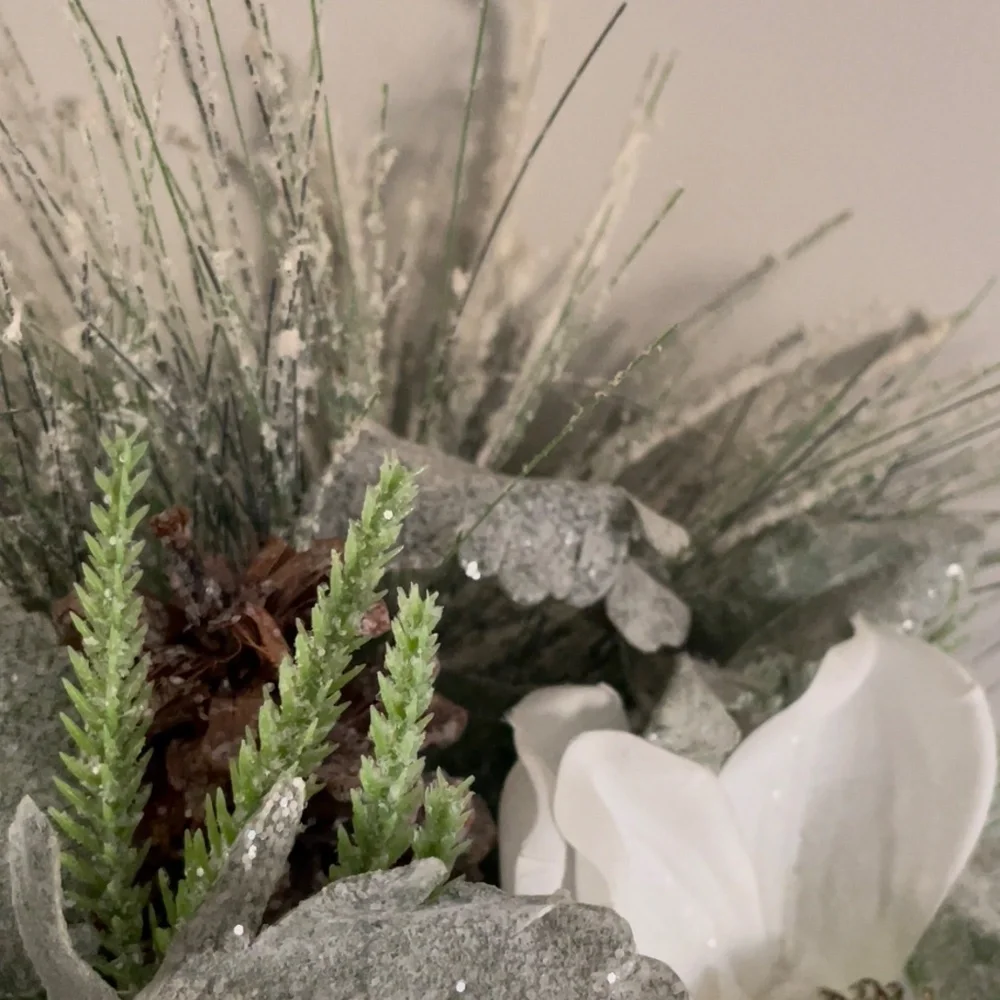 Winter hanging basket floral decor pinecones white flowers pine needles wreath